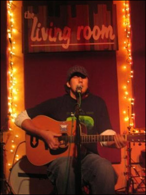 Justin gigging at The Living Room in New York City [Photo Courtesy Justin's MySpace]