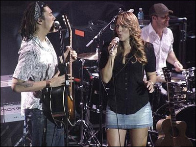 Justin on stage with Colbie Caillat [Photo Courtesy Justin's MySpace]