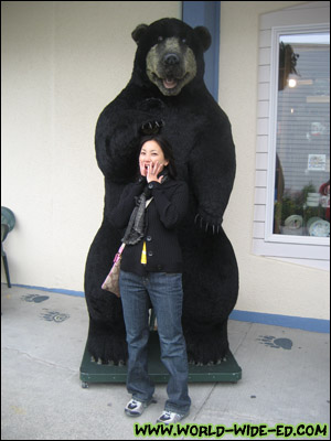Wifey getting mauled, er petted by big bear.