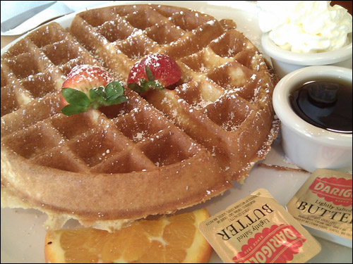 Belgian Malted Waffle - a light and crispy waffle dusted with powdered sugar, served with butter and syrup. ($6.95) (Photo Courtesy: Rick Nakama)