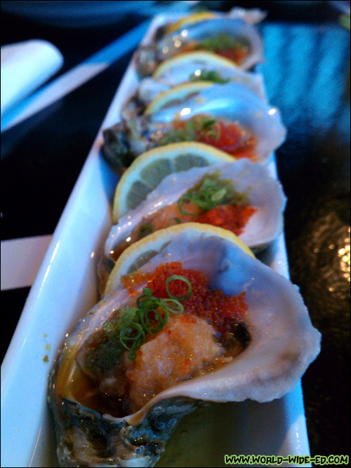 Oysters on the 1/2 Shell (Half dozen Gulf oysters served on shaved ice with citrus oroshi, tobikko, jalapeno masago, & spicy ponzu sauce - $12)