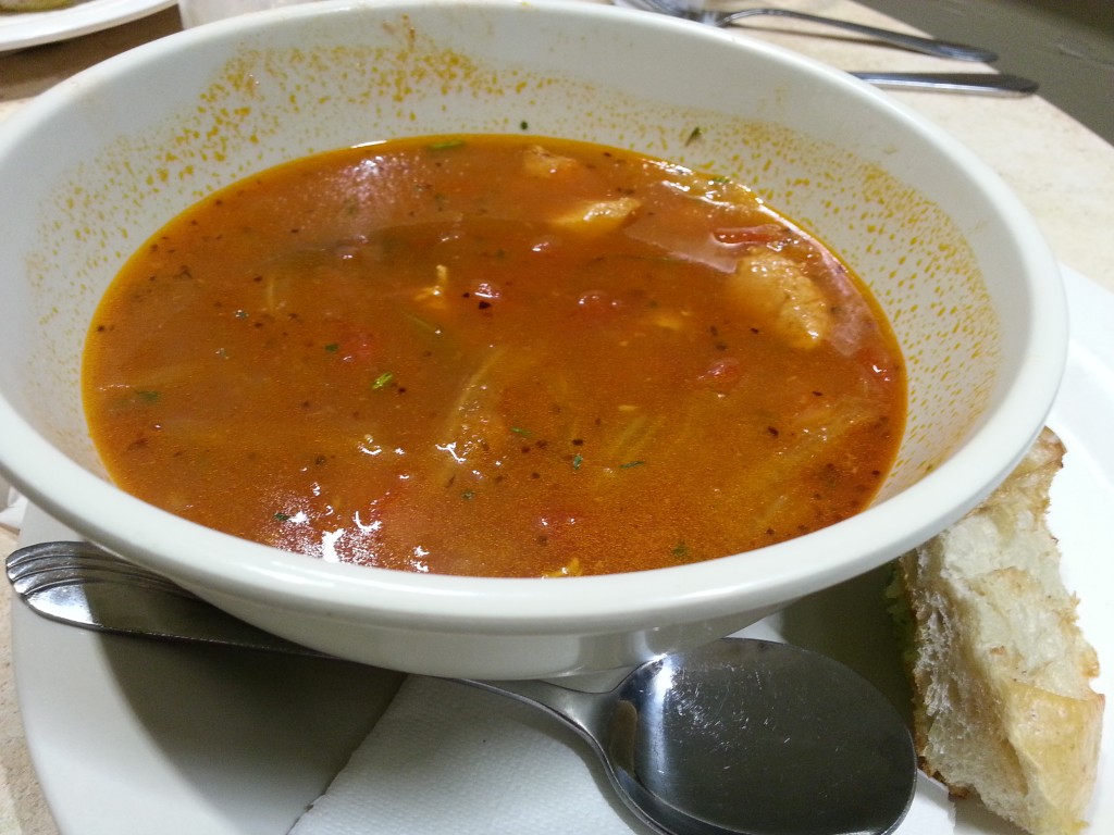 Bouillabaisse - Tomato saffron broth served with fish, clam and mussels. Served with sourdough garlic bread ($8)