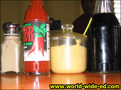 Mandatory saimin condiments: pepper, chili sauce, mustard and shoyu