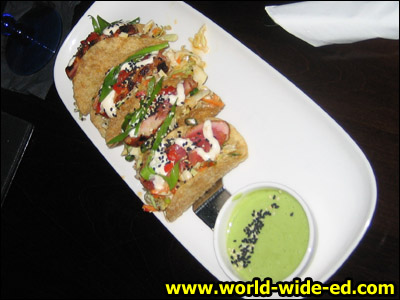 Ahi Tuna Tacos - Seared rare Ahi tuna, Asian coleslaw, wonton tacos, & wasabi-lime aioli. ($8.99)