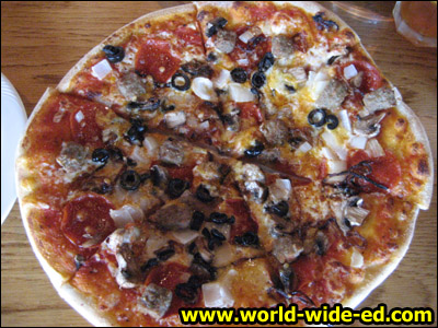 Terrace Special Combo Pizza - Marinara Sauce, Four Cheeses, Pepperoni, Italian Sausage, Mushrooms, Kula Onion, and Sliced Black Olives - $19