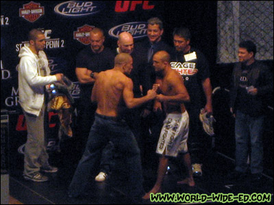 The much anticipated BJ Penn-Georges St Pierre stare down, as St.-Pierre's head trainer Firas Zahabi, an unknown male, UFC President Dana White, ring announcer Bruce Buffer, Penn's head trainer Rudy Valentino and fight matchmaker Joe Silva look on.