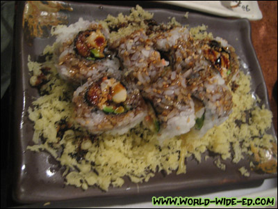 Dave's Moon Roll order (Freshwater eel, yum yum scallop & avocado served on a bed of tempura crumbs topped with eel sauce).