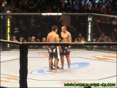 Lyoto Machida and Thiago Silva stare down each other as they get instructions from referee Yves Lavigne