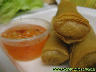 Crispy Spring Rolls (Ground chicken, bean threads, carrots, black fungus, onions & taro wrapped in wheat-flour paper. Golden fried until crispy. Served with lettuce, cucumbers, mint & a house special sauce. ($5.95)
