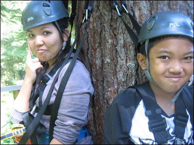 Leanne, who is deathly afraid of heights, holds back the tears after her first zip, while Chris smiles on