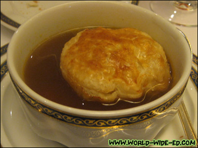 Oxtail En Croute - Flavorful classical soup slow-simmered and served in a crisp pastry crust