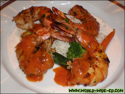 Sauteed Shrimps "Provencales" - Scented with Mediterranean herbs, tomato concassee, florets of crisp, tender broccoli and sticky rice [Photo credit: Andi Kubota]