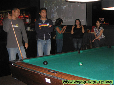 Shooting pool at Belltown Billiards