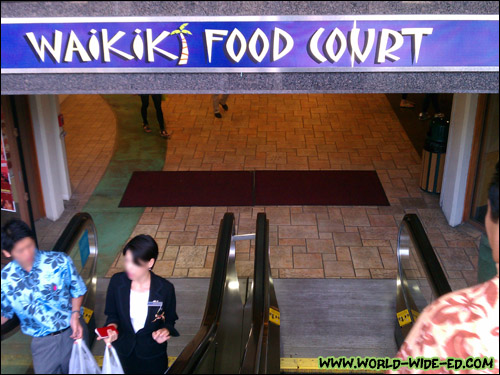 Taking the escalator down to the Waikiki Shopping Plaza's Food Court