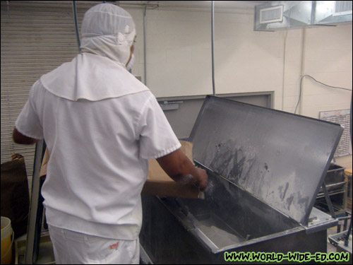 Sun Noodle employee throwing in the ingredients for this batch of noodles