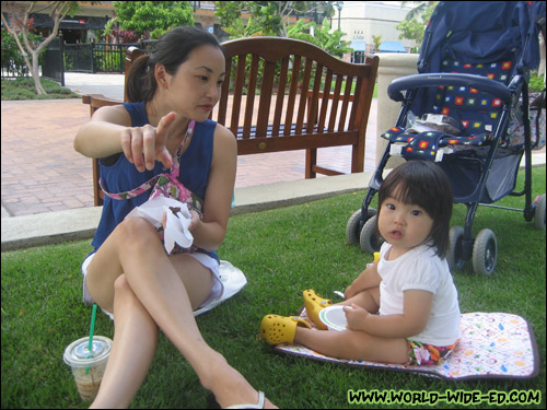 Wifey and baby enjoying a quickie picnic at the Queens' MarketPlace