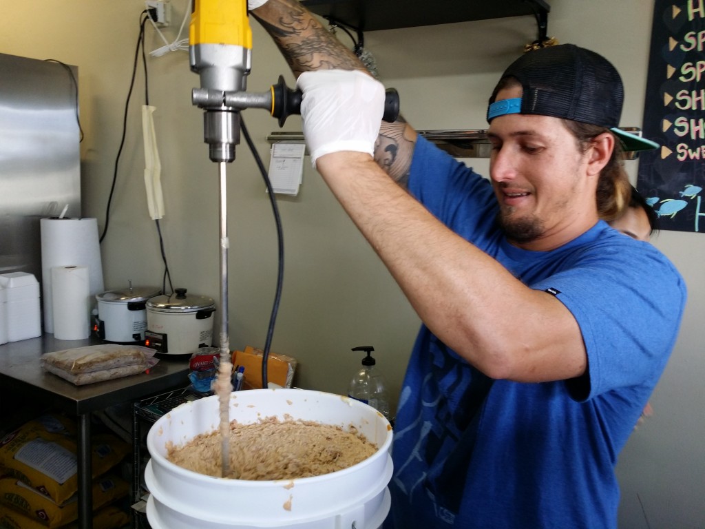 Schade preparing the Smoked Ahi Dip with custom power tools