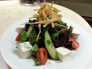 Watercress Salad - Fresh locally grown watercress and 'Nalo Greens tossed with tofu and topped with crispy won ton strips and Nico's ginger sesame dressing on the side ($12.25)